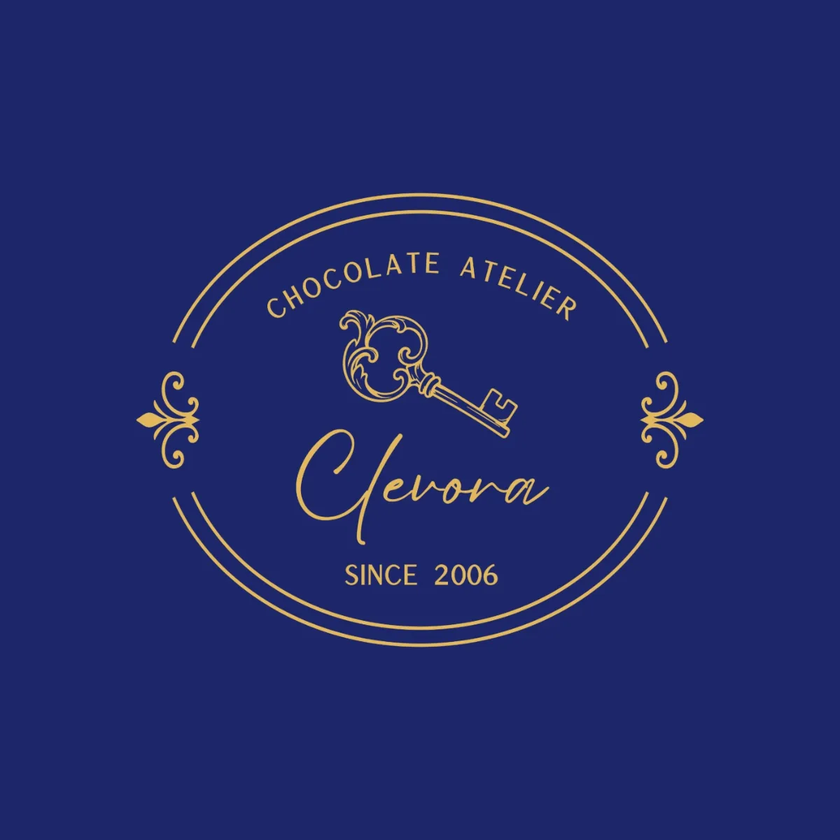 Clevora Chocolate Atelier logo with an antique key, in gold on navy