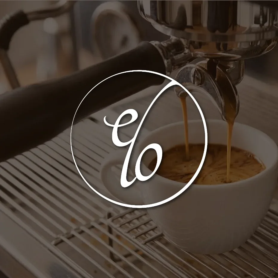elo café monogram logo in a thin circle over espresso pouring into a cup