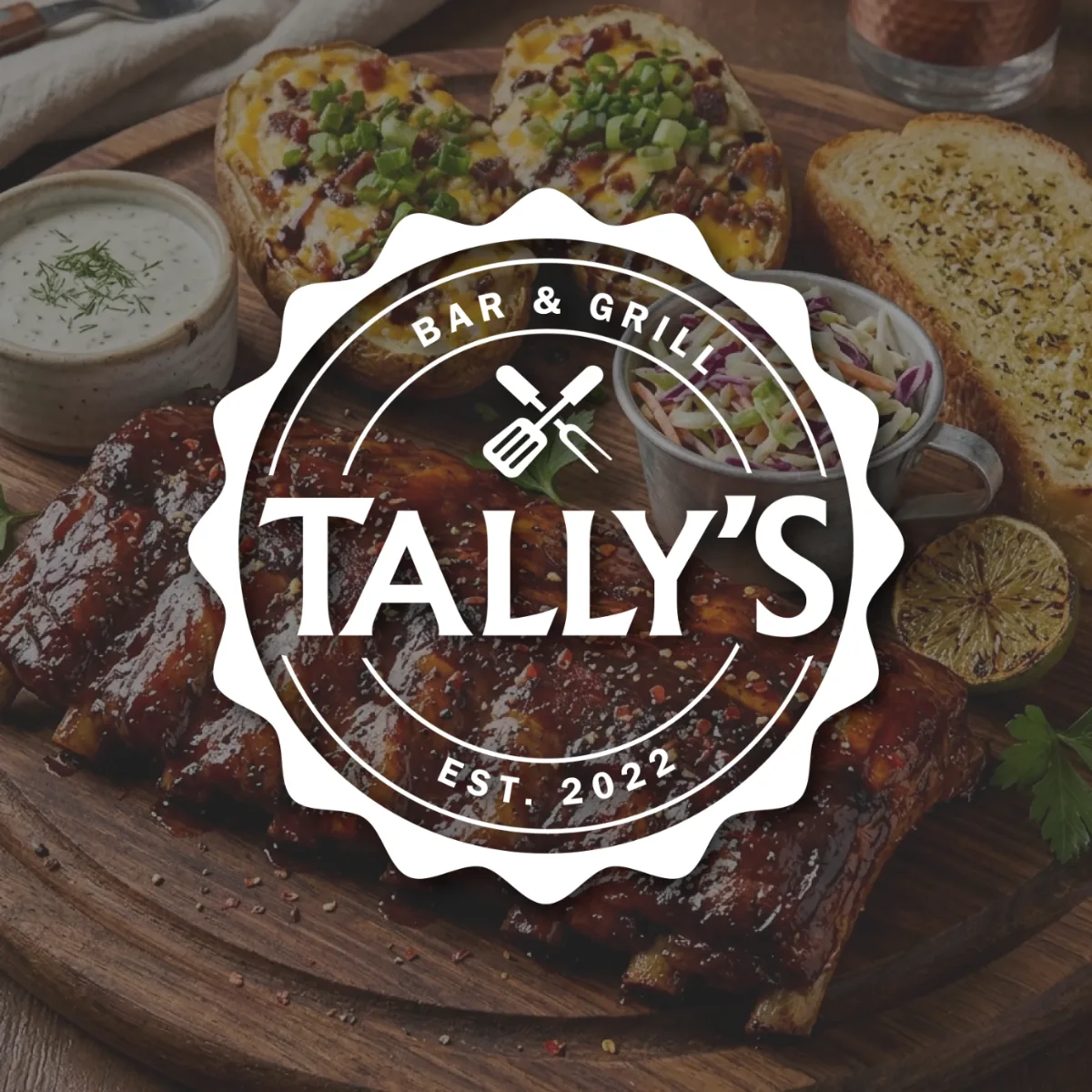 Tally's Bar & Grill badge logo in white over ribs, bread, and sides